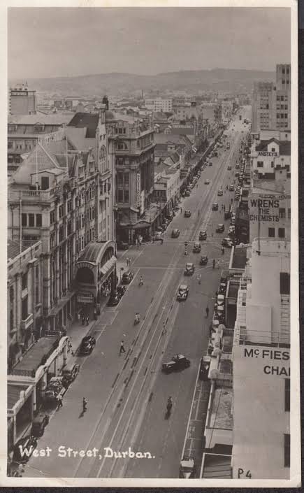 Archive photograph of West Street, Durban, with tram lines and early motor cars